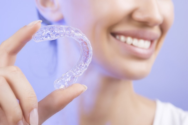 Clear aligners used in pediatric orthodontics to straighten teeth