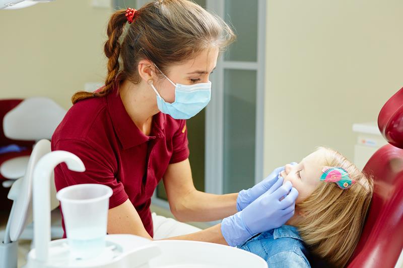 Dental sealants applied to a child's molars