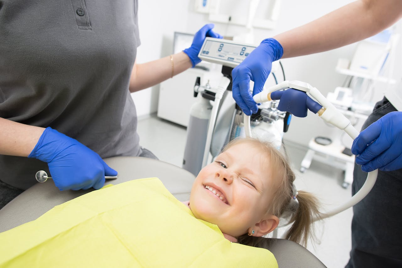 Child receiving nitrous oxide sedation dentistry treatment